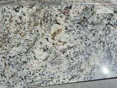 Pallet of Assorted Granite Slabs of Varying Shapes, Sizes and Colors