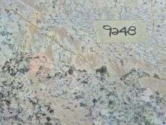 Slab of Granite L-Shaped (White with Black/Grey/Beige Veining/Marbling Pattern)