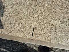 Slab of Granite (Beige with Light and Dark Brown and Grey Specked Pattern)