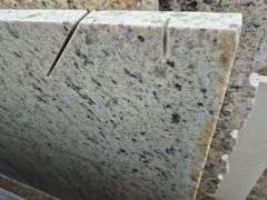 Slab of Granite Irregular Shape (White with Grey/Purple/Beige Speckled Pattern)