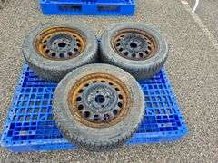 3 Michelin X-Ice Tires Mounted on Rims (185/65R15)