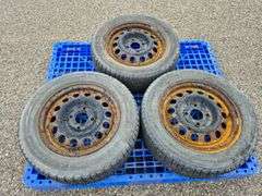 3 Michelin X-Ice Tires Mounted on Rims (185/65R15)