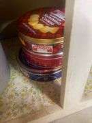 Tins, storage containers+ contents of cabinet