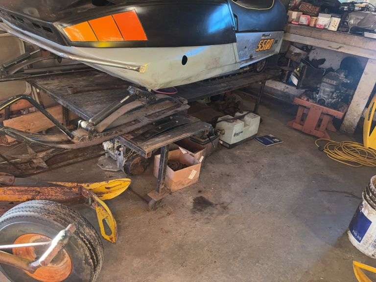 Wheeled snowmobile work stand