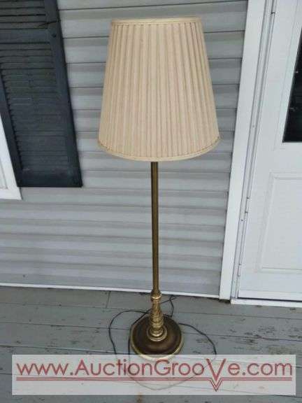 Brass floor lamp with shade. Stands 54in without shade.
