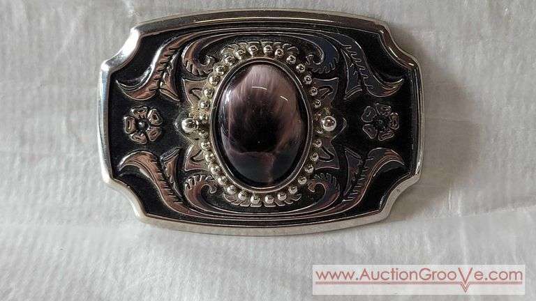 2.5" x 1.75" Buckle "Made in USA " with approximately a 25 mm Oval Cabochon. According to examples found the Cabochon is probably "sheen obsidian" or "rainbow obsidian. Characteristics include a dark,