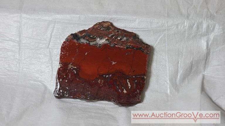Unpolished Slab. Either Jasper or Agate but a note found with it says Agate. 5" x 4.5" x 1/4" and weighs 174 grams. It's photographed wet and dry. B1