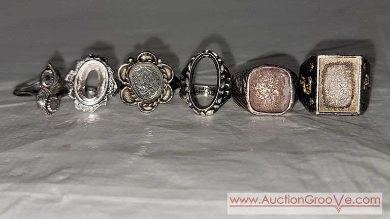 6 Rings marked STERLING SILVER weighing 39.3 grams, (plus 1 "spoon ring" not silver). B1