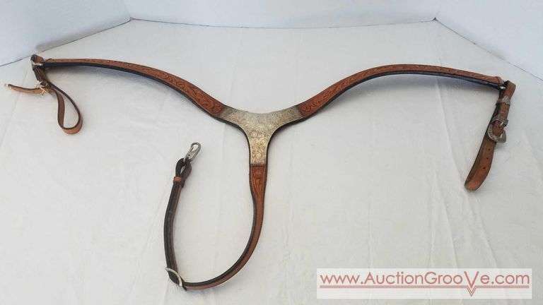 Leather breastcollar with silver overlay and and acron/oak design. Adjustable straps measure 26in from middle of silver plate to end of strap. Breast strap in very good used condition and comes with w