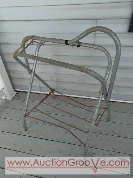Metal saddle stand is sturdy and has twine strap replacement, see photos. Stand is 36Hx19Wx26D.