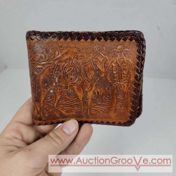 Two Vintage Hand Tooled Leather Wallets. A