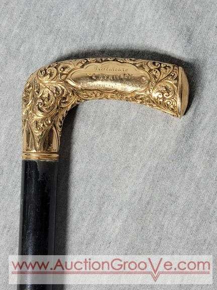 Golden Handle Cane inscribed, "Presented to E. Stanley Employee of National Bag Co. 33". A2
