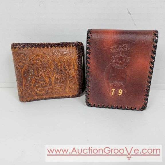 Two Vintage Hand Tooled Leather Wallets. A
