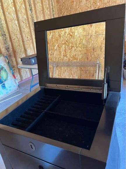 Jewelry Armoire from the Bombay Store Top opens with a 12”X 10” Mirror and cabinet has 5 single drawers, with a Double size bottom drawer.  40” H X 18” W X 14” L. See Photos. MA