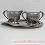 Reed and Barton Silver Soldered coffee, Plymouth salt and pepper Shakers and cream and sugar on a bent tray. A