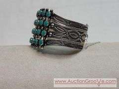 Native American ~ Turquoise & Sterling Silver. Snake Eyes Cuff Bracelet. Matches examples found for 4 Row, Petit Point, Zuni. Safety chain appears to be a replacement. MB