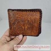 Two Vintage Hand Tooled Leather Wallets. A