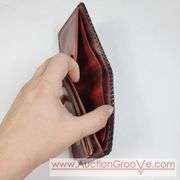 Two Vintage Hand Tooled Leather Wallets. A