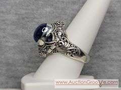 SARDA Sterling Silver Ring. Artisan Gem Collection of Bali. .30CTW Ocal Cabochon and Trillion Tanzanite. Size 9. 12g. JB