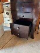 Jewelry Armoire from the Bombay Store Top opens with a 12”X 10” Mirror and cabinet has 5 single drawers, with a Double size bottom drawer.  40” H X 18” W X 14” L. See Photos. MA