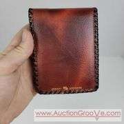 Two Vintage Hand Tooled Leather Wallets. A