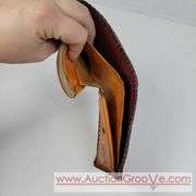 Two Vintage Hand Tooled Leather Wallets. A