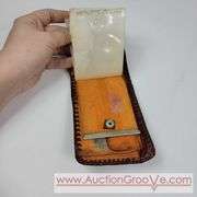Two Vintage Hand Tooled Leather Wallets. A