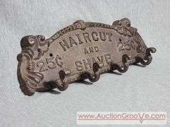 Cast Iron Coat Hanger. Haircut and Shave 25 Cents. 13 x 5. A3