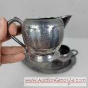 Reed and Barton Silver Soldered coffee, Plymouth salt and pepper Shakers and cream and sugar on a bent tray. A