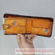 Two Vintage Hand Tooled Leather Wallets. A