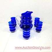Vintage Louie Glass Co. Cobalt Blue Glass Harpo Pitcher and Tumbler 1930's. Wavy Cobalt Blue Pitcher and Five Glasses. 8 x 9.