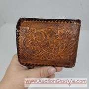Two Vintage Hand Tooled Leather Wallets. A