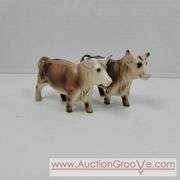 Victoria Ceramics Cow Salt and Pepper Shakers and Kirk Pewter. Both cow sets have one damaged horn each. See photos. A