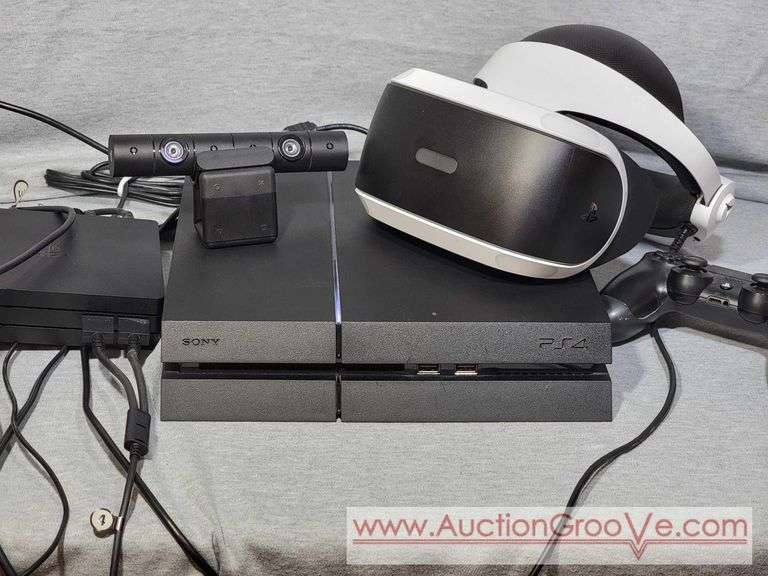 Sony PlayStation PS4. See photos for contents. Powers on but did not test further. VR Headset, Camera, controllers. B
