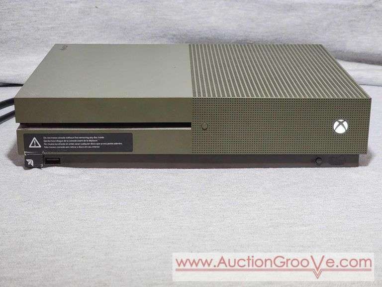 XBox ONE S. Powers on. Did not test further. Has controller and the cords shown in photos. The controller may not work it is cracked. B