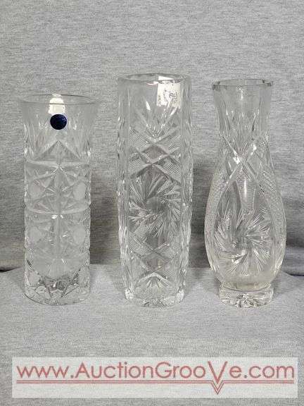 Three Crystal Vases. 8 and 9" tall. B