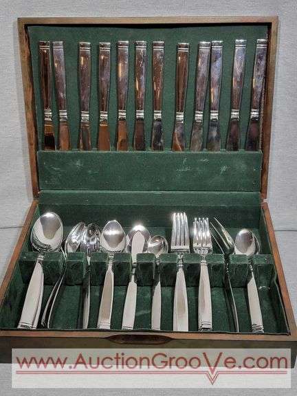 63 Piece Cambridge Stainless Steel Silverware Set. Has some marks, they seem to clean up well. B