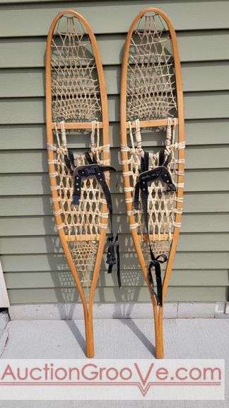 Sinew & Wood SNOWSHOES Made in CANADA in good condition. Each is marked Canada, 10 x 56. Matches pair in next lot. GNF