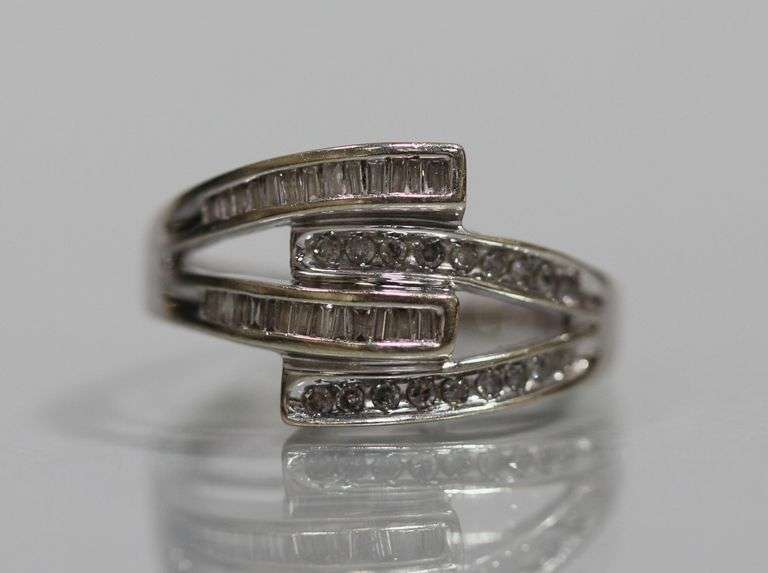 10kt WHITE GOLD / DIAMOND BYPASS RING