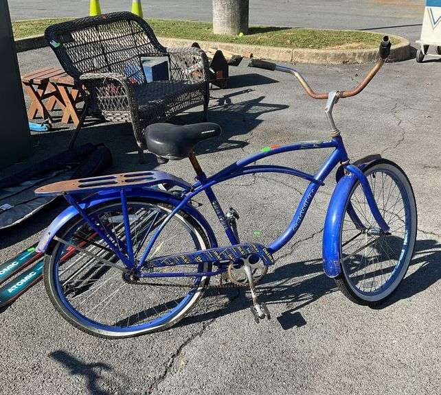 Schwinn beach cruiser style bike, with wide rubber grip handlebars, carrier attachment, wide bottom seat and white wall tires, this would be a fun restoration project