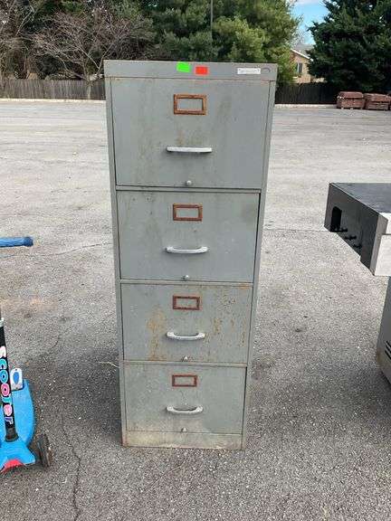 Metal filing cabinet, four drawer, rusty and drawers are hard to open