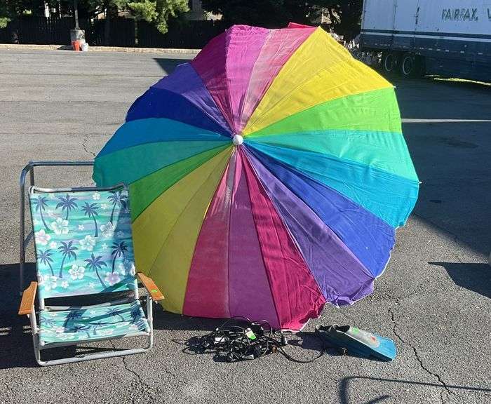 Beach chair, stripped umbrella 7.5”dia(faded and tilt button is broken), poly coats string lights(non tested by Hash Auctions), hydro flippers