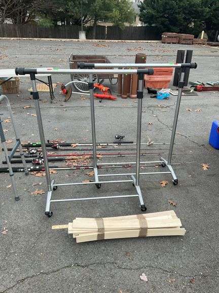 Pair of adjustable clothing racks with wooden boards 30”L