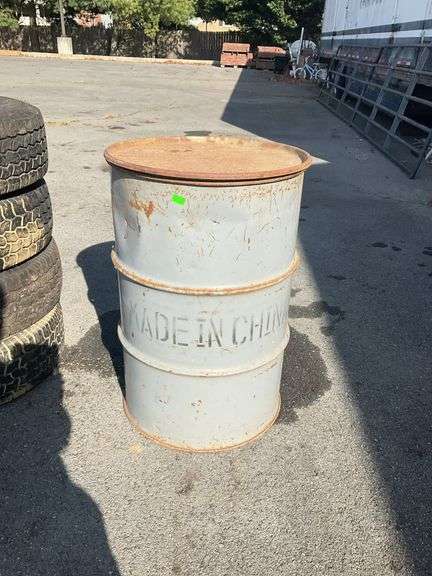 Metal drum, with lid, 22”dia x 35”there is rust but would be a good burn barrel