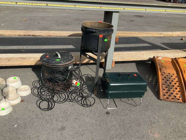 Metal stand, speckled stock pot, table top charBroil grill, wine bottle, lidded ash bucket, all items have rust and grill non tested by Hash Auctions