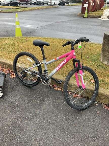 Nishiki bike, rubber grip handlebars, 24”wheels, 12”frame, elevated seat, 7+gearshift, ready to ride condition