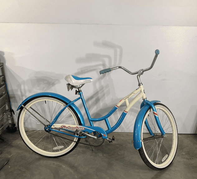 Schwinn bike, legacy edition., rubber wide grip handlebars, wide bottom blue/white seat, blue fenders, white wall tires, brakes work, there is some rust, otherwise ready to ride condition