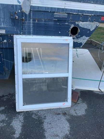 Double-hung window with screen, 41”H x 31”W