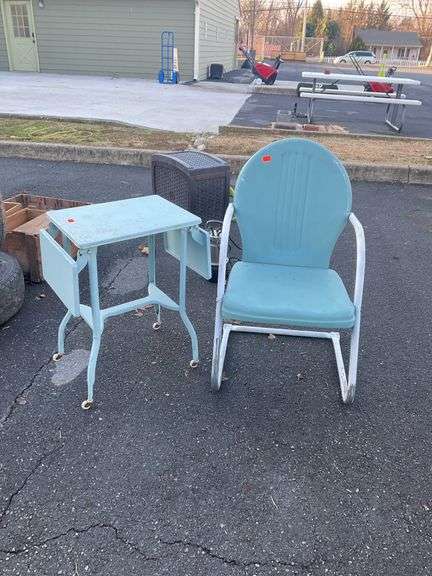 Outdoor metal chair with drop leaf side table, both items have some rust
