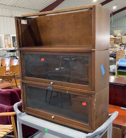 Three section barrister bookcase. Top section is missing glass and door